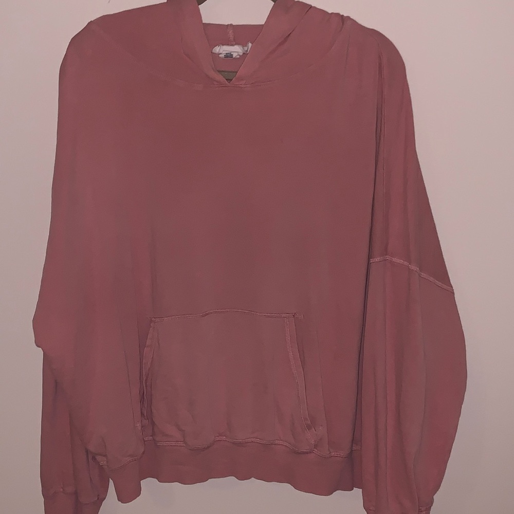 Pale pink hoodie.